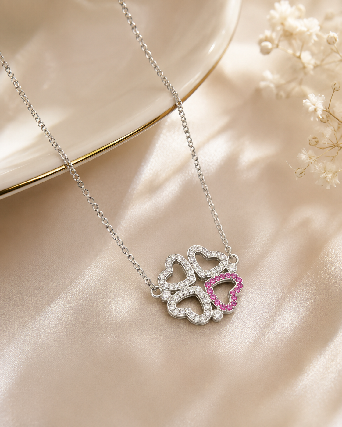 Elegant Rhodium Plated Four Leaf Clover Necklace with one Pink Heart – Convertible Design