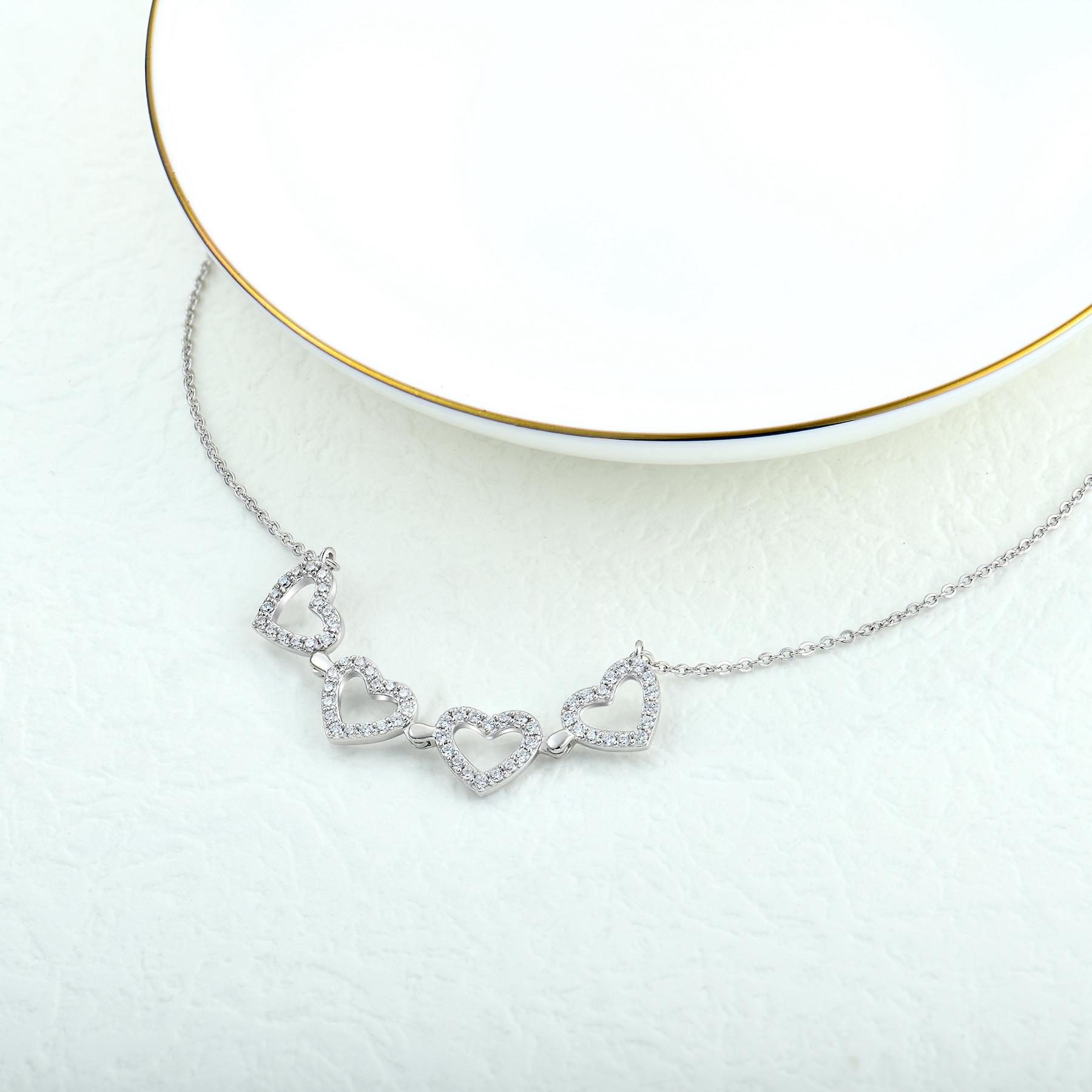 Elegant Rhodium Plated Four Leaf Clover Necklace with one Pink Heart – Convertible Design